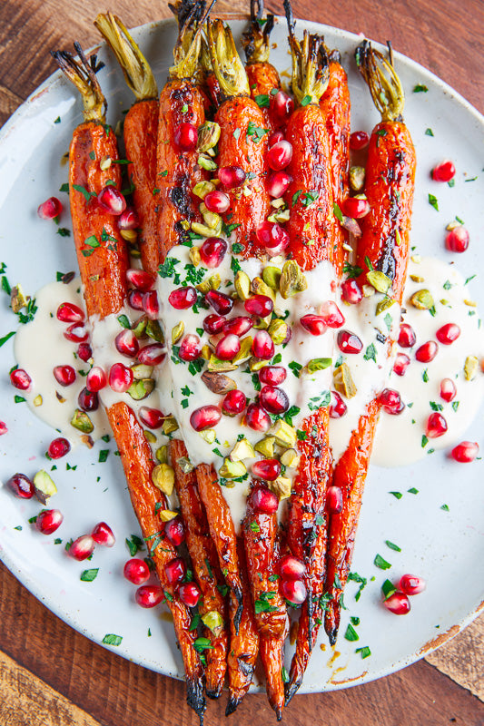 Maple Roasted Carrots in Nojo Tahini Sauce with Pomegranate and Pistachios