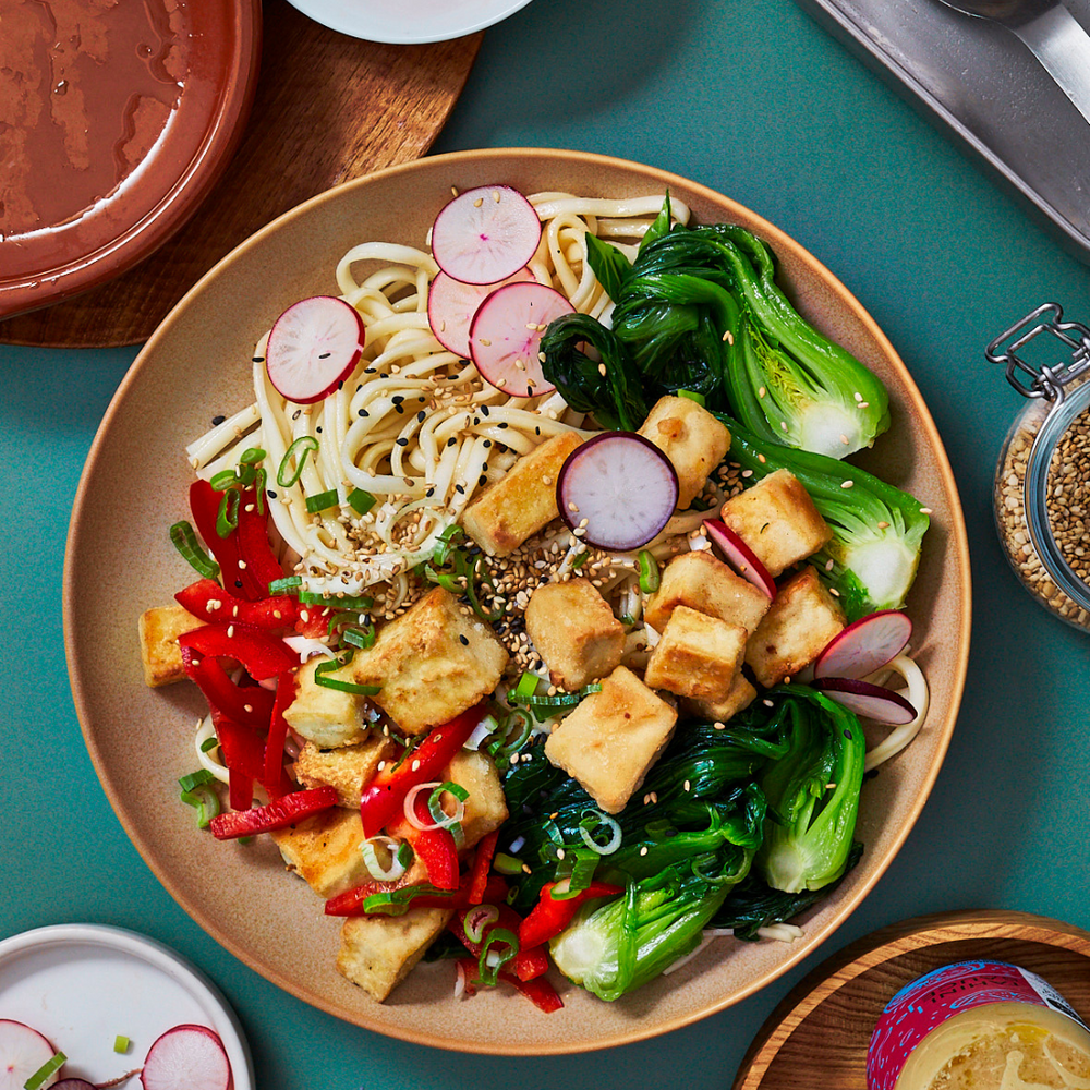 Smashed tofu and kale fried noodles with Nojo Tahini Sauce