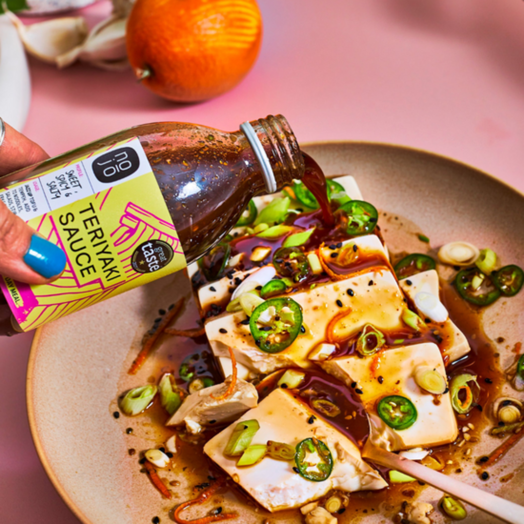 Hot steamed silken teriyaki tofu topped with spring onion, orange and chilli