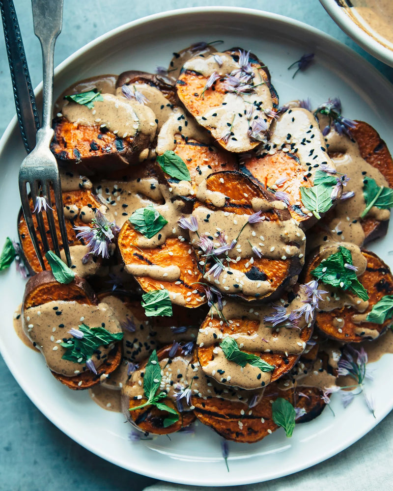 Grilled Sweet Potatoes with Nojo Tahini Sauce By The First Mess